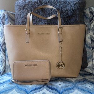 Michael Kors tote and matching wallet.